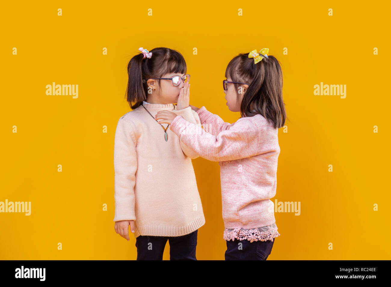 Adorable extraordinary children with down syndrome talking to each other Stock Photo Alamy