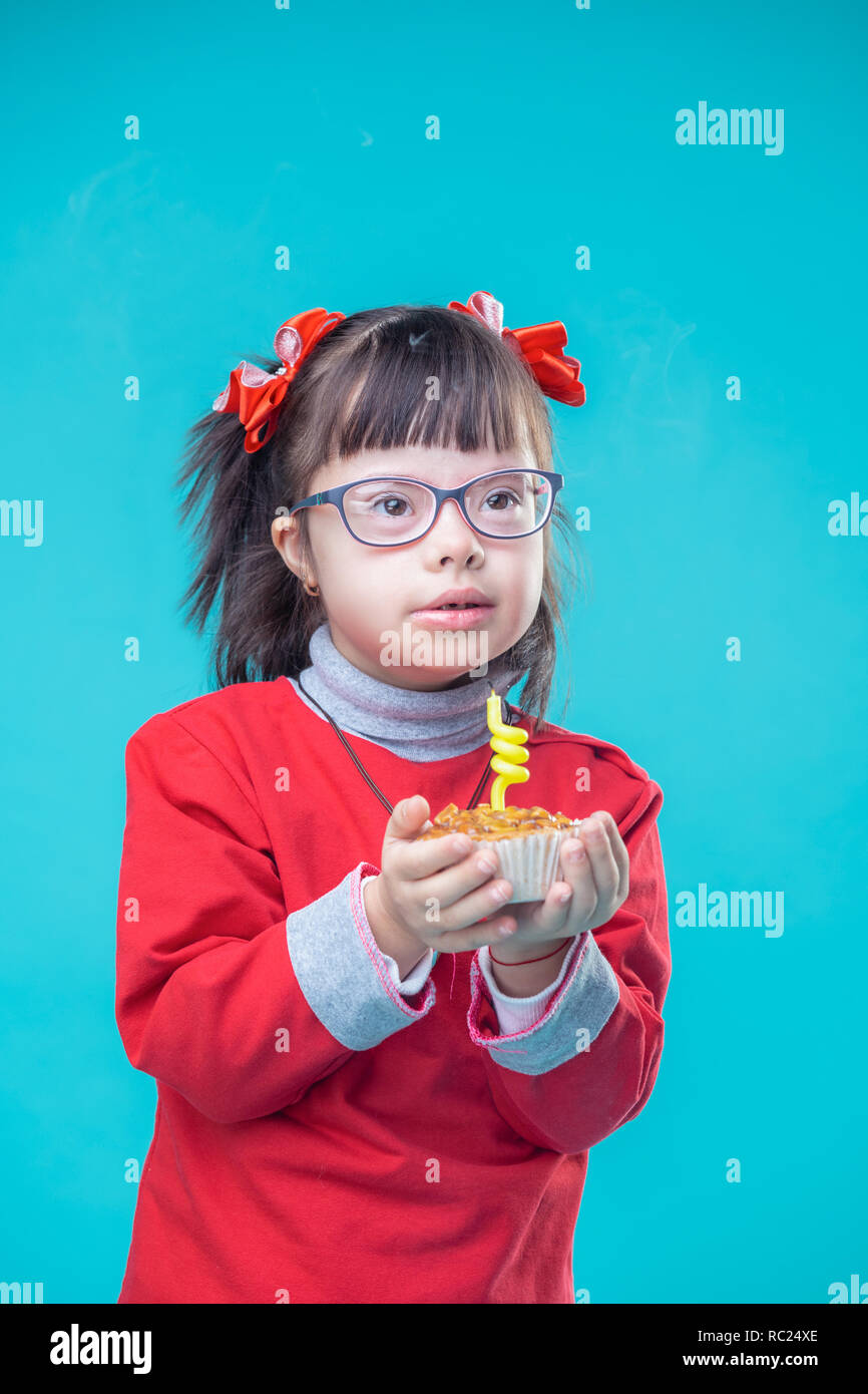 Interested young lady wearing clear glasses and accurately carrying