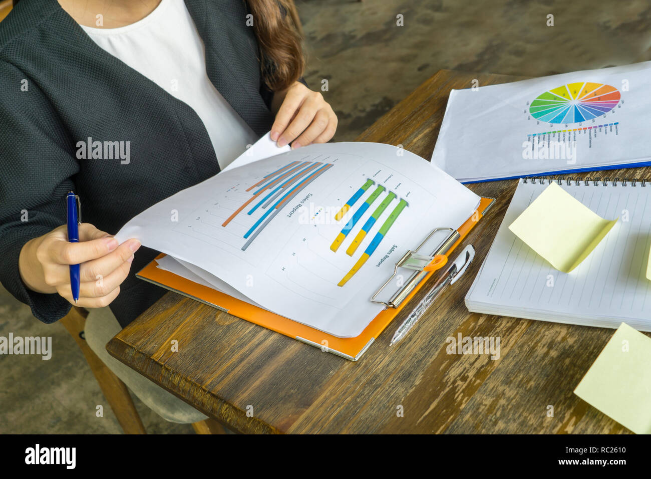 Manager checking sales reports Stock Photo