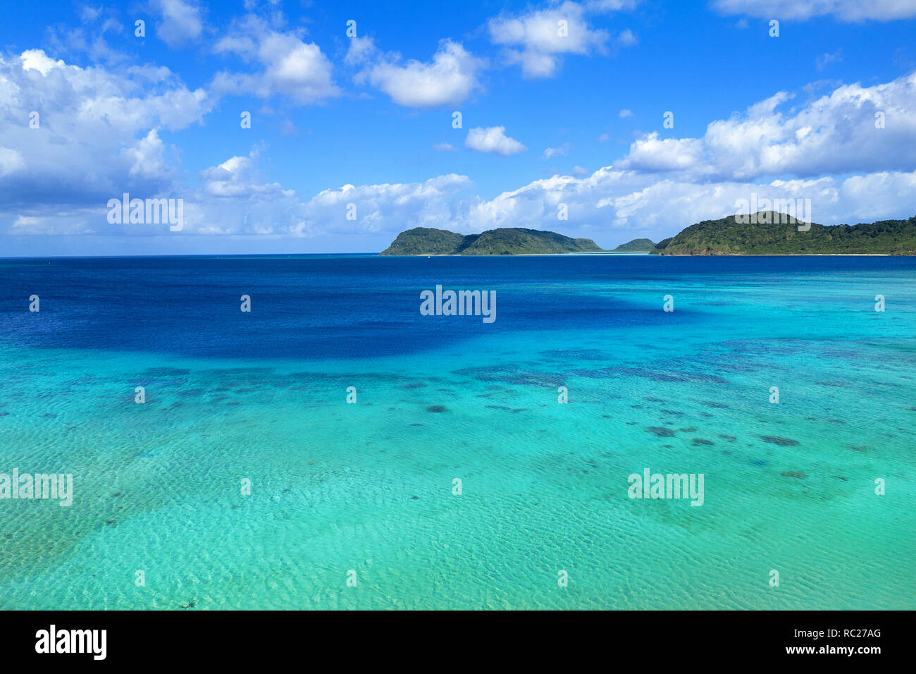 Aerial view of paradise beach, coral reef and turquoise waters at ...