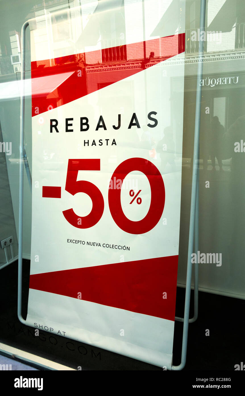 For sale sign in the window of a clothing store in Seville, Spain Stock Photo Alamy