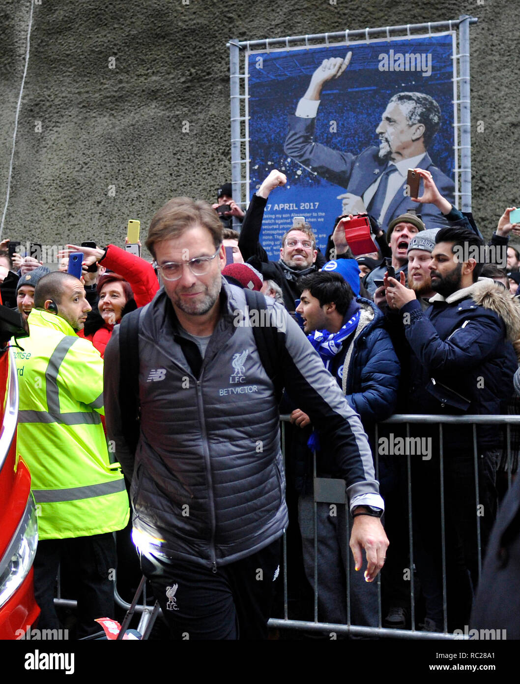 Liverpool manager Jurgen Klopp arrives with his lookalike behind for the Premier League match between  Brighton & Hove Albion and Liverpool at the American Express Community Stadium . 12 January 2019 Editorial use only. No merchandising. For Football images FA and Premier League restrictions apply inc. no internet/mobile usage without FAPL license - for details contact Football Dataco Stock Photo