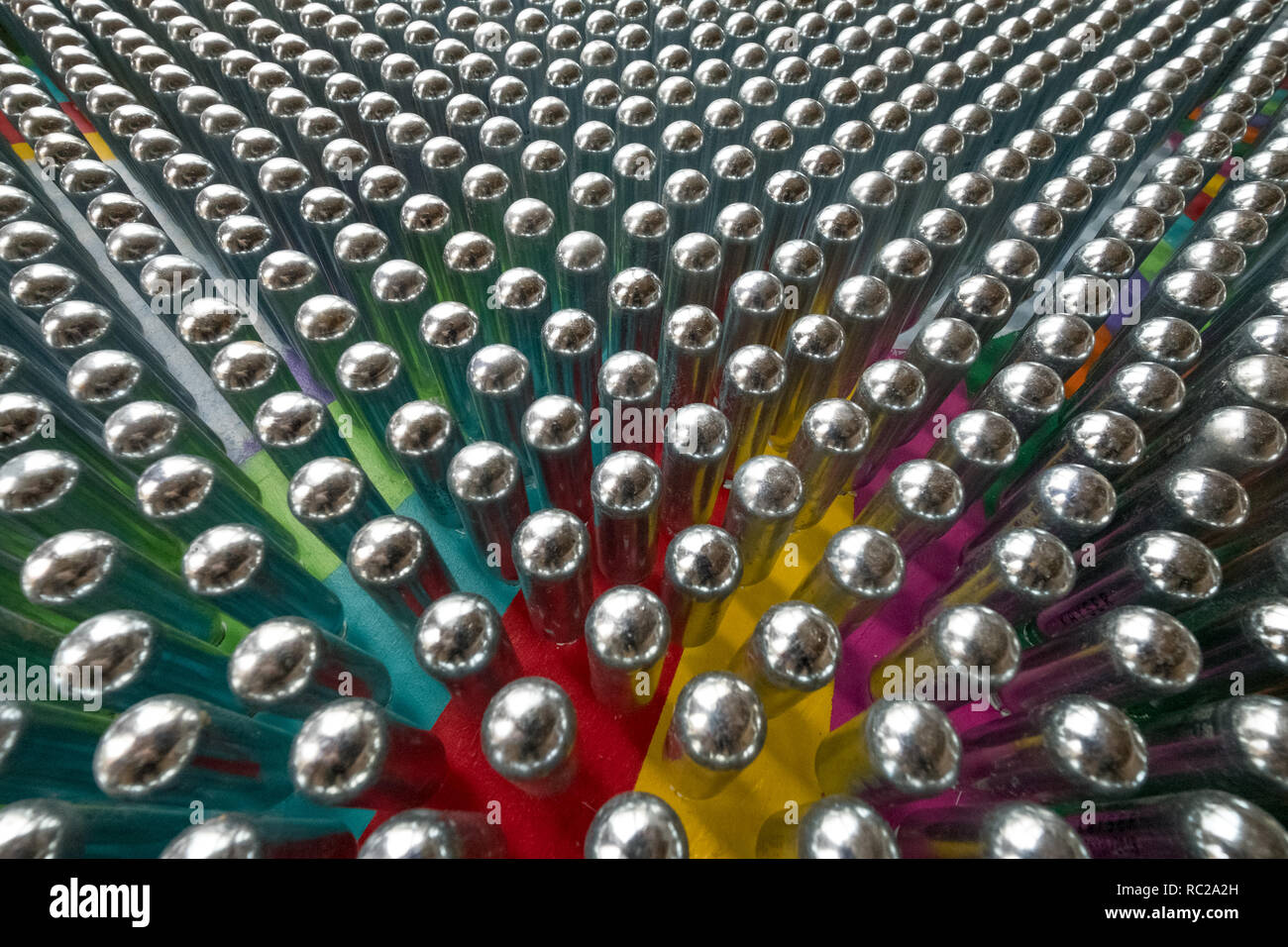 Cream chargers / nitrous oxide cannisters reflecting colourful