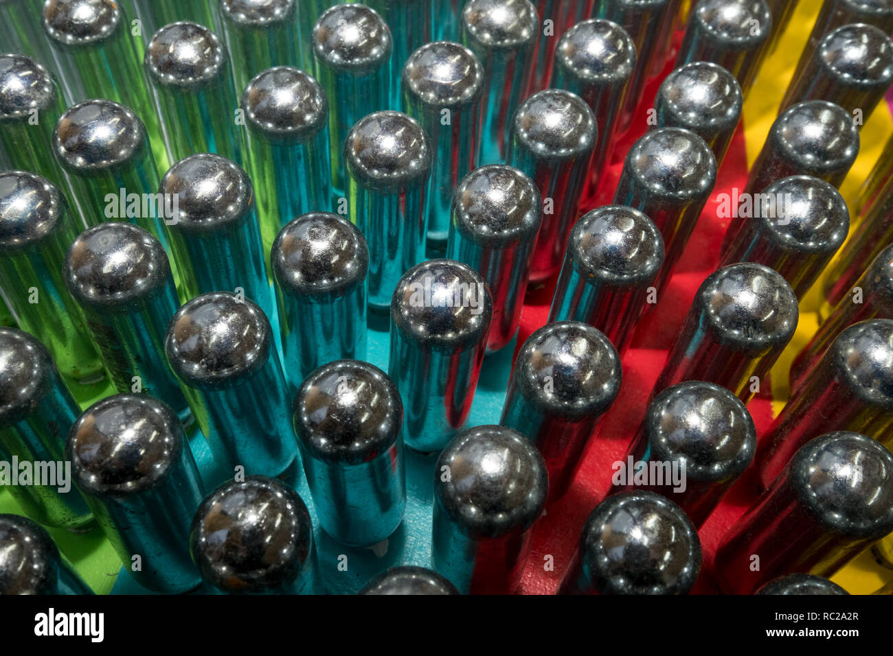 Cream chargers / nitrous oxide cannisters reflecting colourful