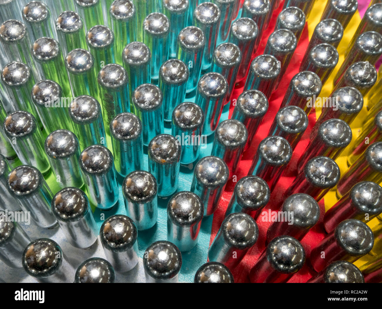 Cream chargers / nitrous oxide cannisters reflecting colourful