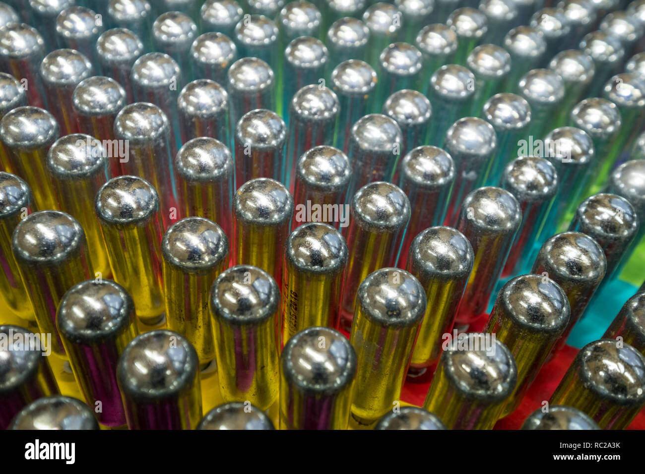 Cream chargers / nitrous oxide cannisters reflecting colourful