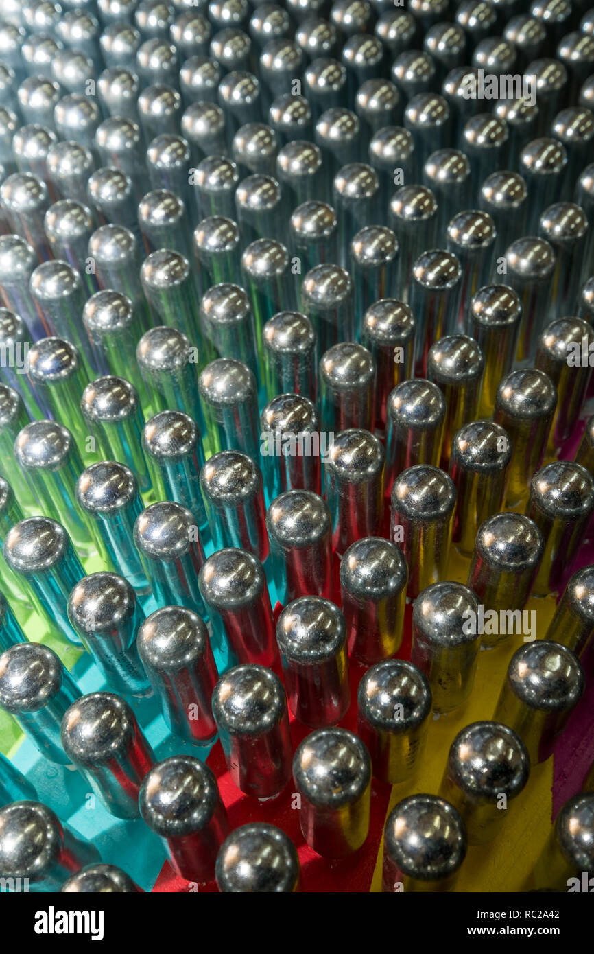 Cream chargers / nitrous oxide cannisters reflecting colourful