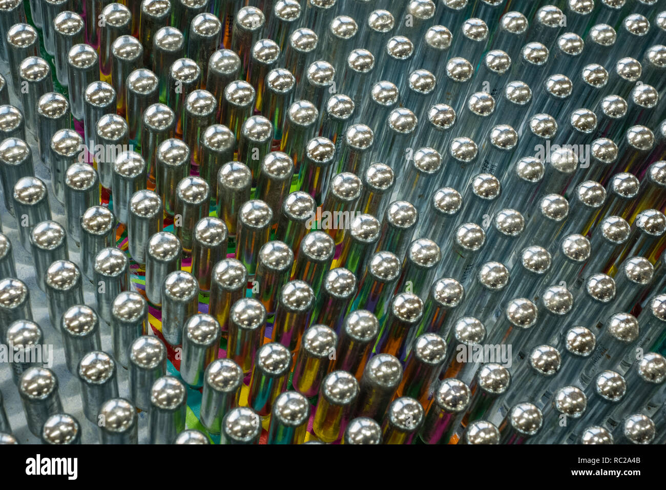Cream chargers / nitrous oxide cannisters reflecting colourful