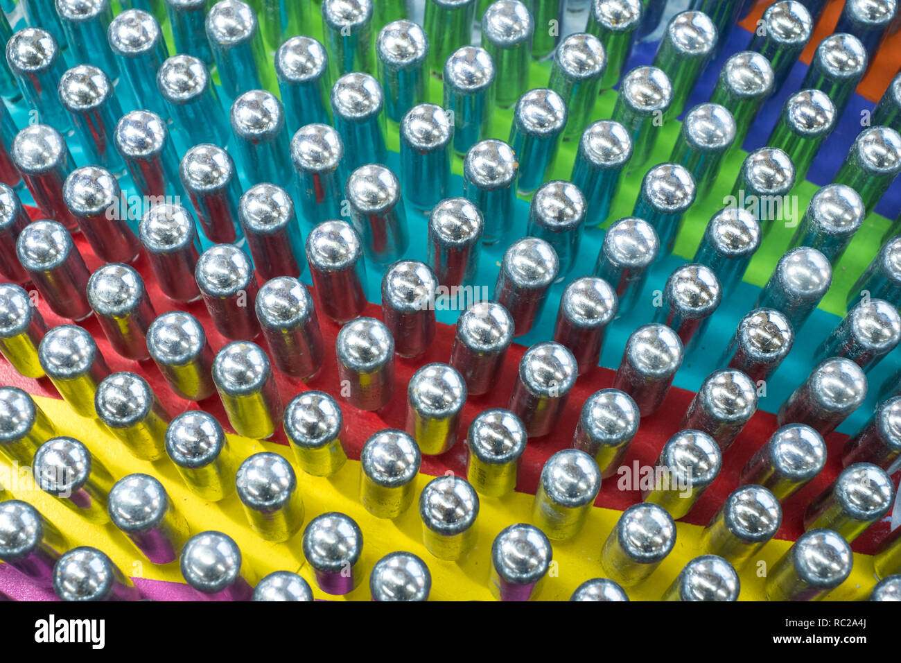 Cream chargers / nitrous oxide cannisters reflecting colourful