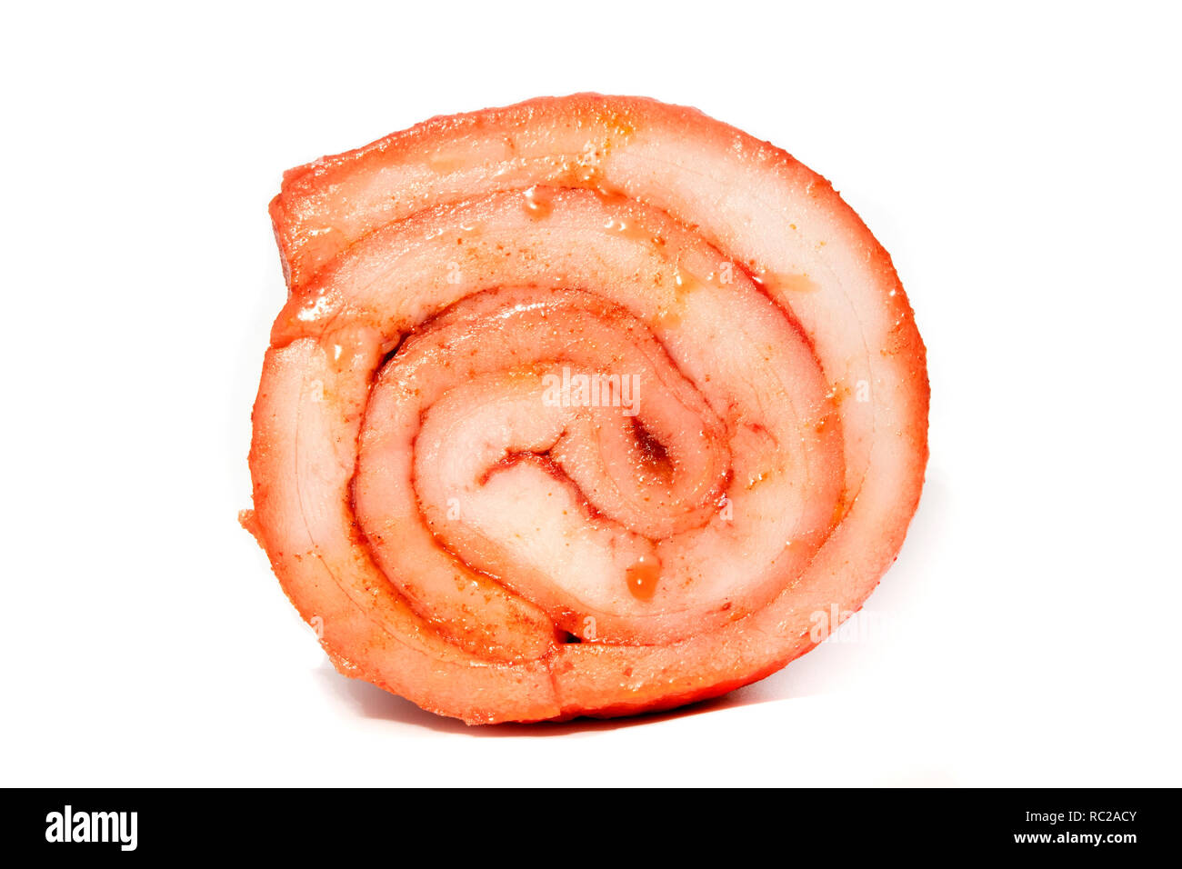 Slavic cured rolled pork with paprika on a white background Stock Photo