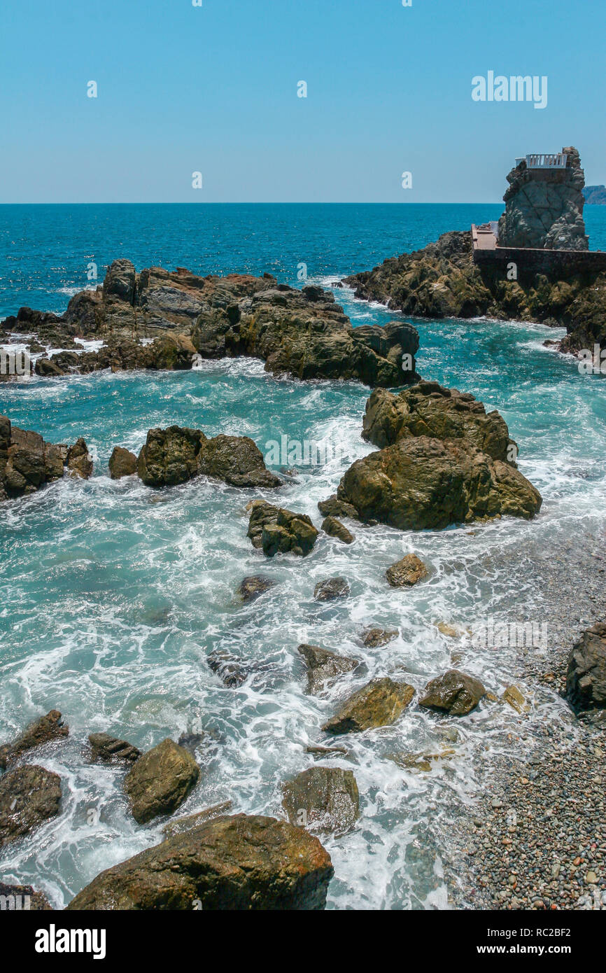 Waves hitting cliff on beach hi-res stock photography and images - Alamy