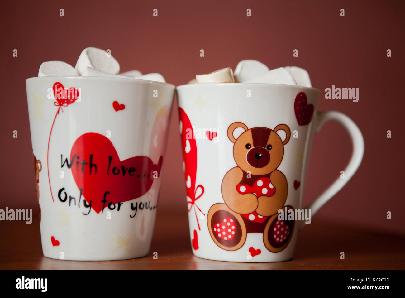 Hot chocolate with white marshmallows in hearts and teddy bears on Valentine's Day Stock Photo