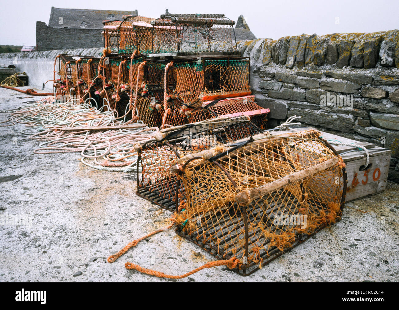 Lobster pots used by local fishermen on the Old Pier at South Wick, Papa Westray, Orkney, Scotland. Metal and wood frames covered in nylon netting. Stock Photo