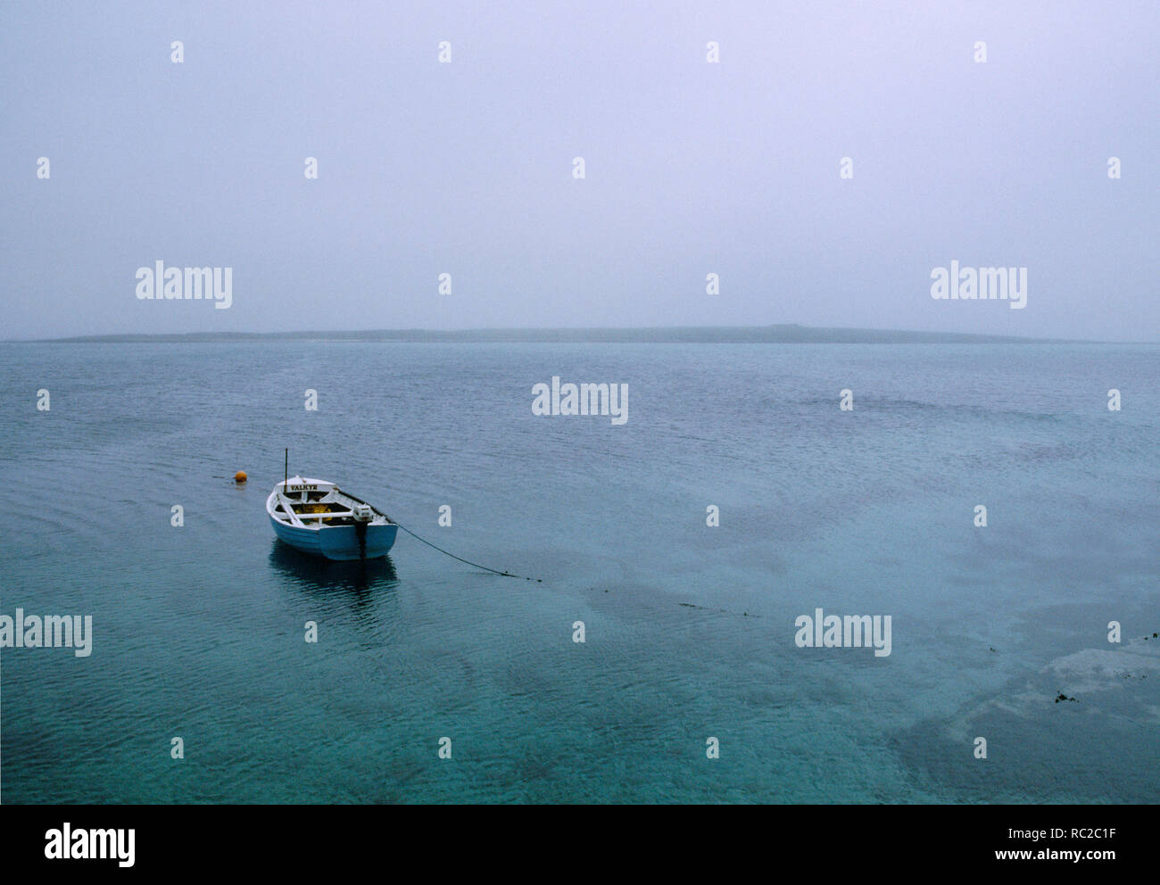 Misty view from Old Pier across South Wick to the small island of Holm of Papa Westray, Orkney, Scotland. Stock Photo