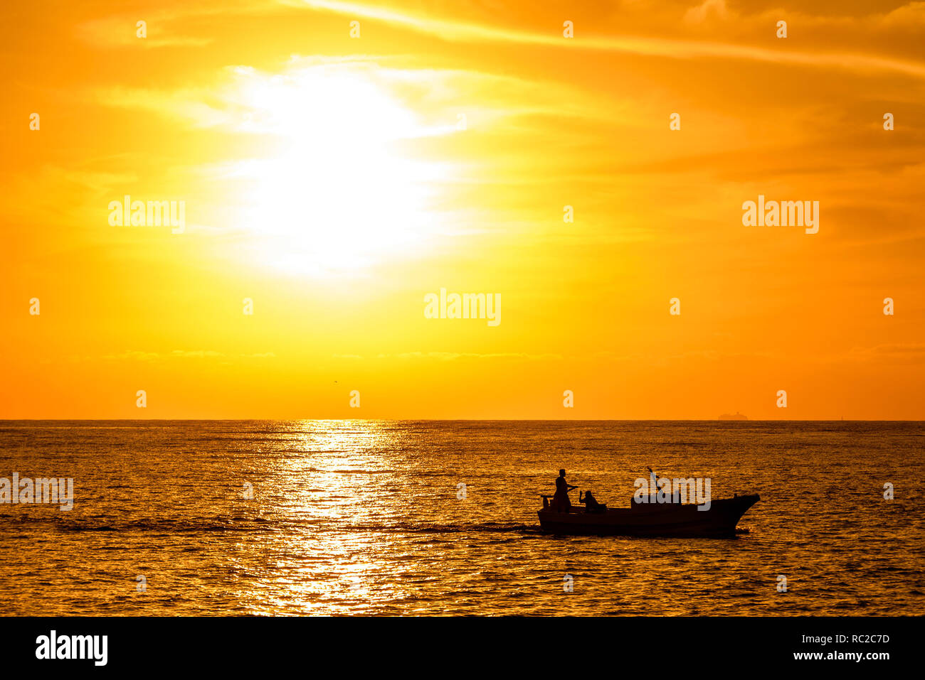 Setting Sun Spotlights Solitary >> Silhouette Of A Fishing Boat Passing In Front Of An Orange Sunset Setting Sun Spotlights Solitary >> Silhouette Of A Fishing Boat Passing In Front Of An Orange Sunset