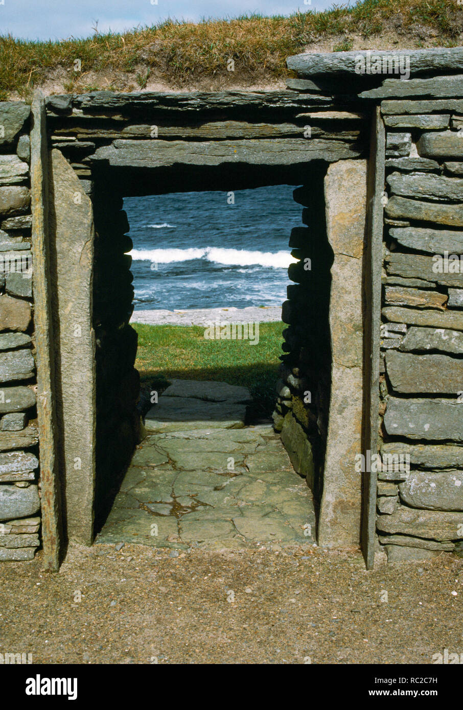 Knap of Howar, Neolithic Farmstead, Papa Westray, Orkney. Western Looking out through the western doorway of the southern building. Stock Photo