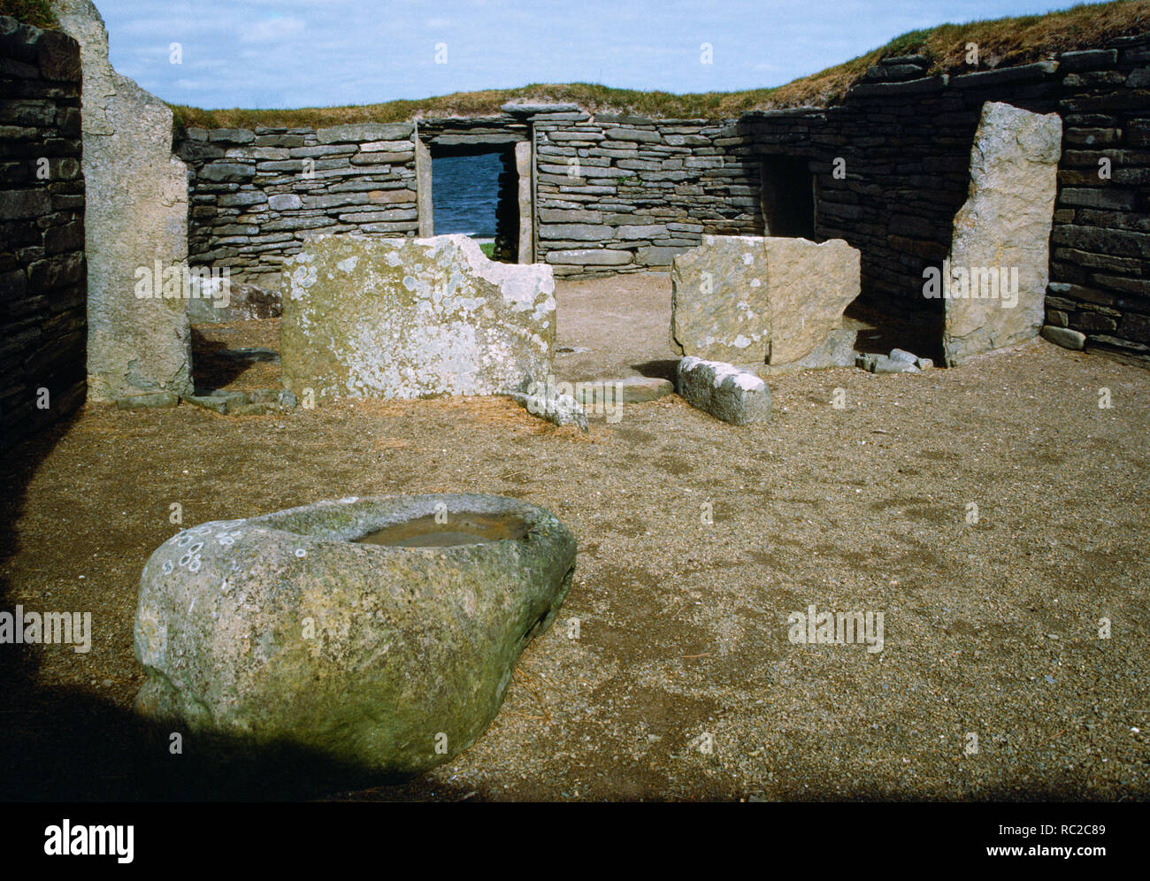 Knap of Howar, Neolithic Farmstead, Papa Westray, Orkney. Interior of the southern building, showing west doorway and upright slab divisions Stock Photo