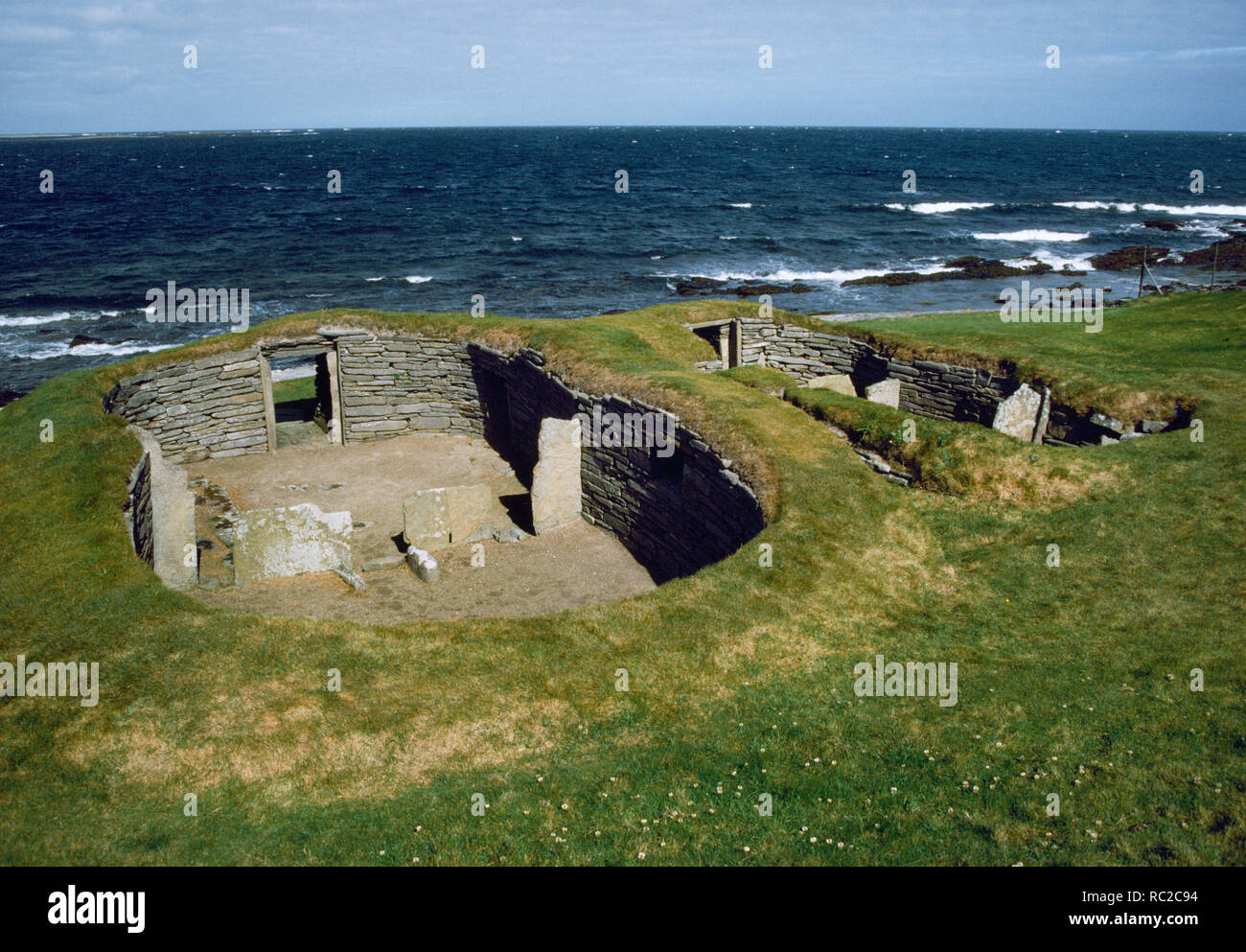 The Knap of Howar, Neolithic Farmstead, Papa Westray, Orkney. Looking west over the two buildings to the sea. The southern house in the foreground Stock Photo