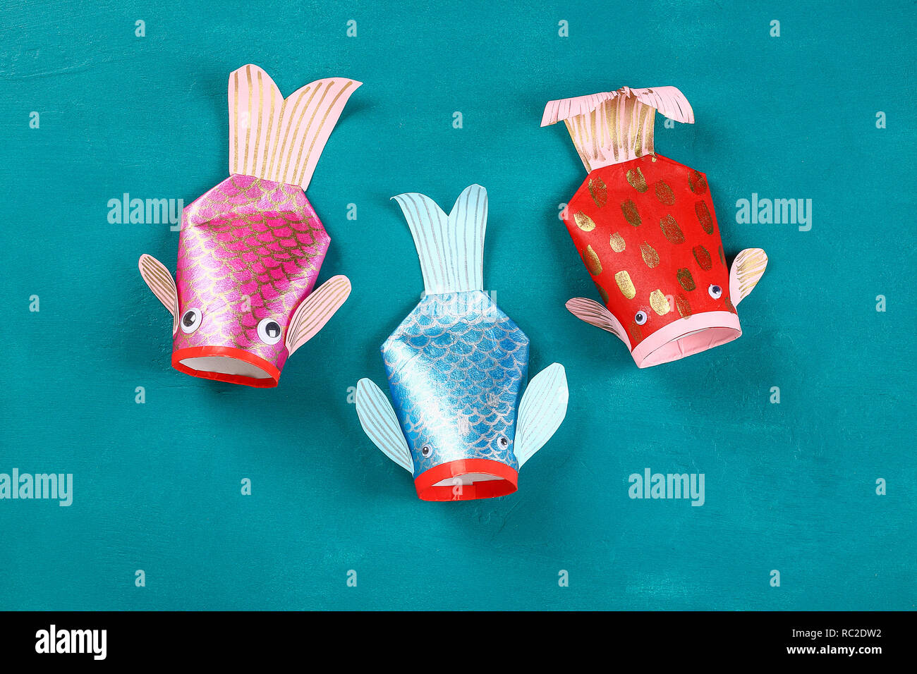 Diy koi carp fish on blue green background. Gift ideas, decor for the  Chinese new year. Kid handmade. Carp koi fish of paper, toilet roll, googly  eyes Stock Photo - Alamy