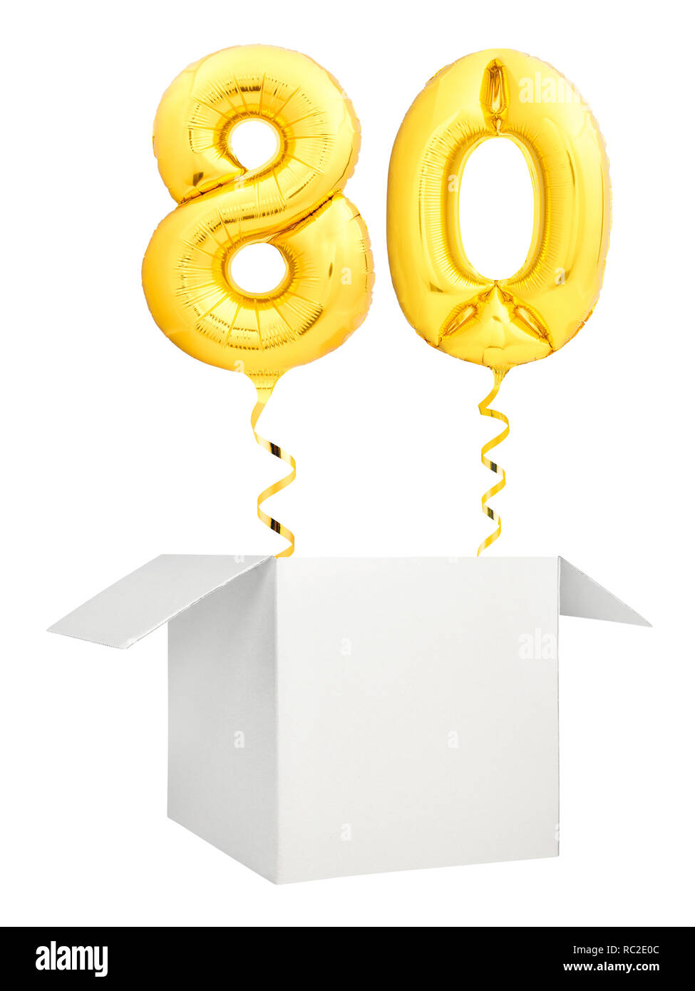 Golden number twenty balloon flying out of blank white box isolated on white background Stock Photo