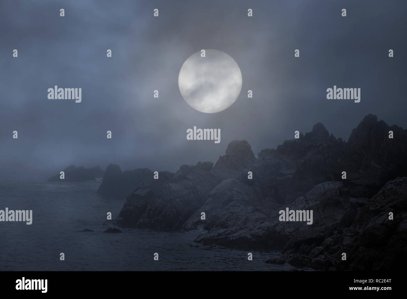 Rocky sea coast in a foggy and overcast full moon night Stock Photo - Alamy