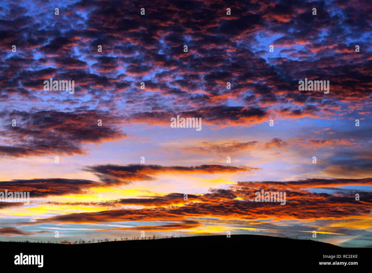 Dramatic red sunset clouds on sky Stock Photo