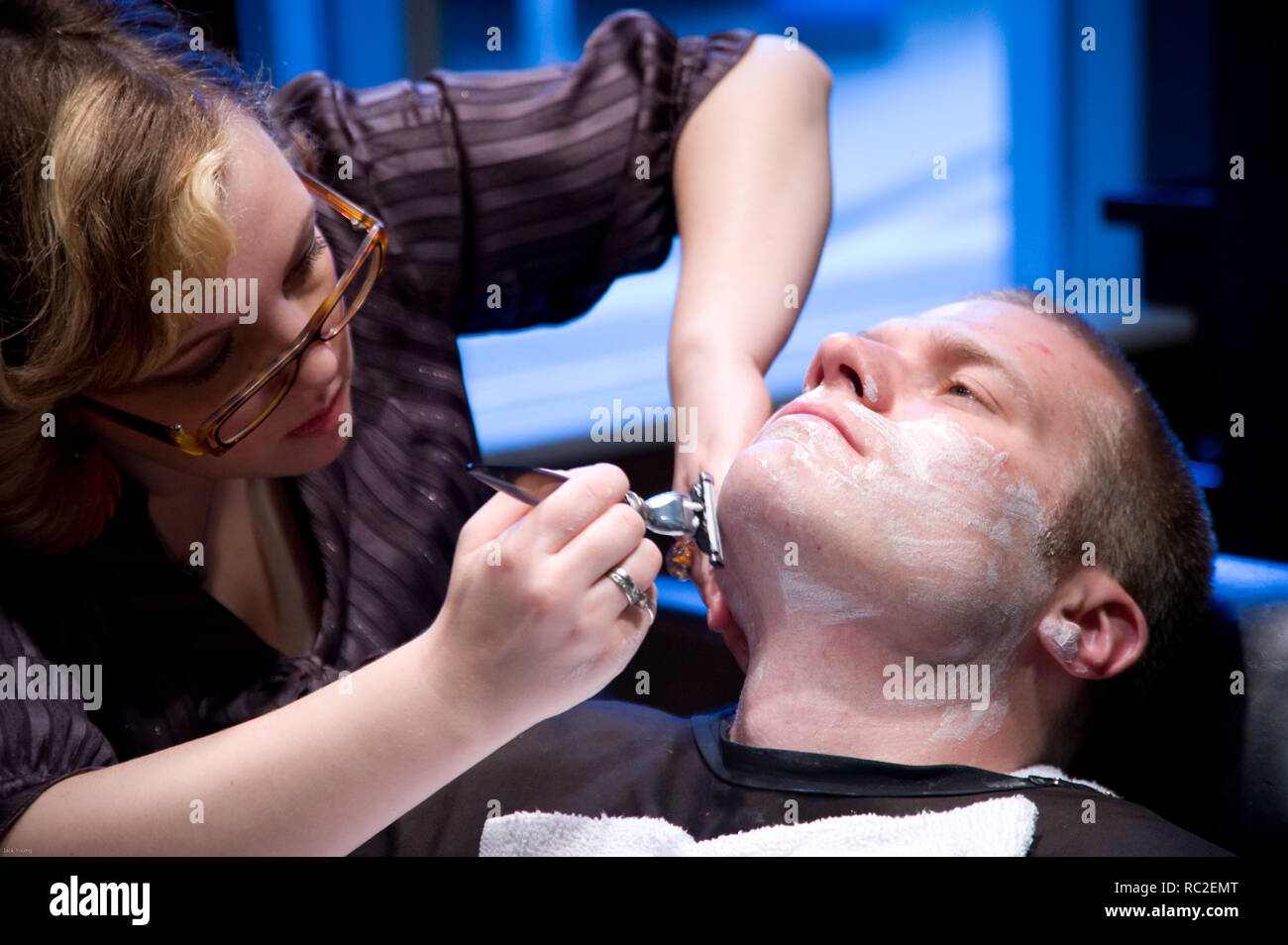 Men get grooming services at barbershop for men Stock Photo