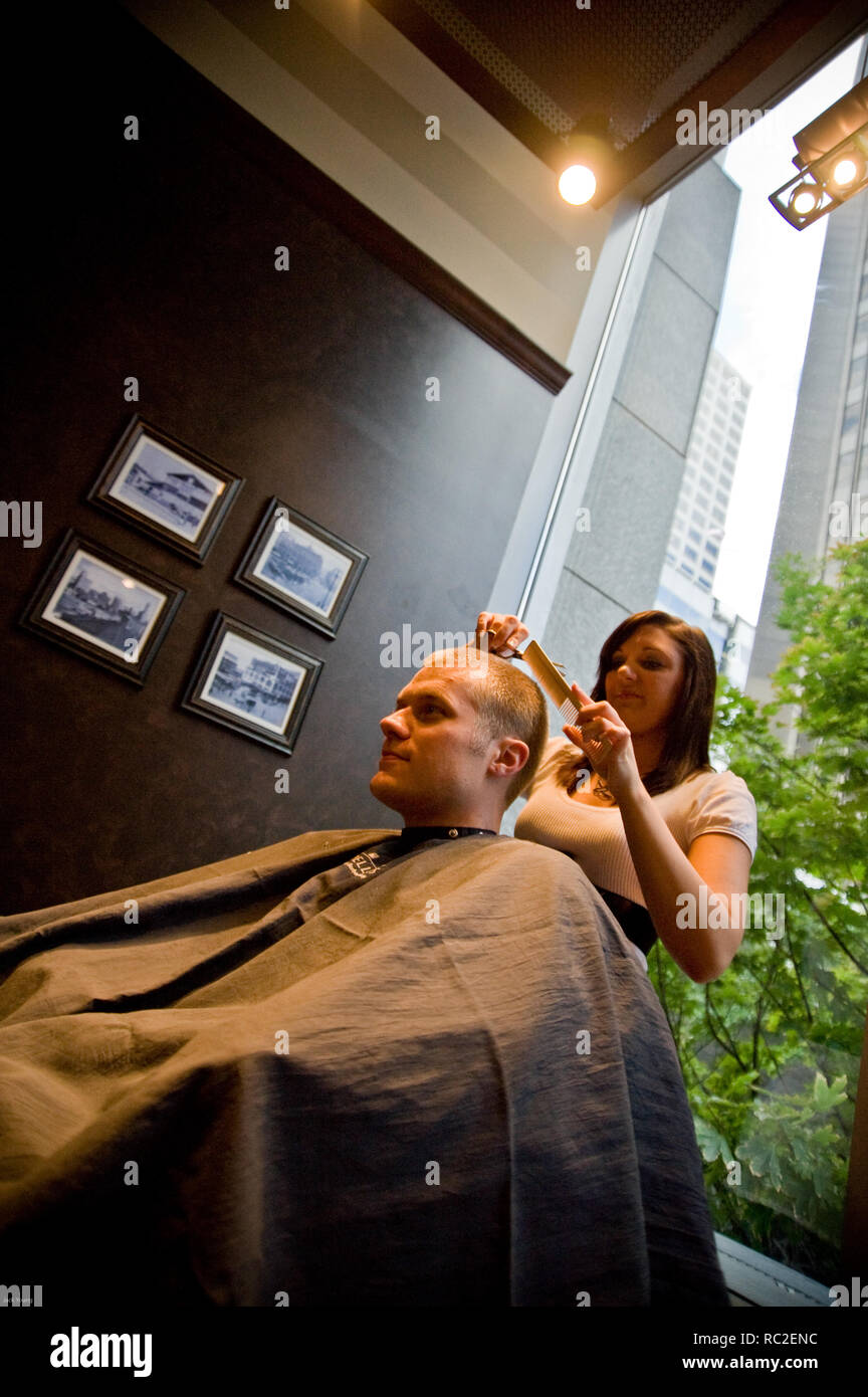 Men get grooming services at barbershop for men Stock Photo