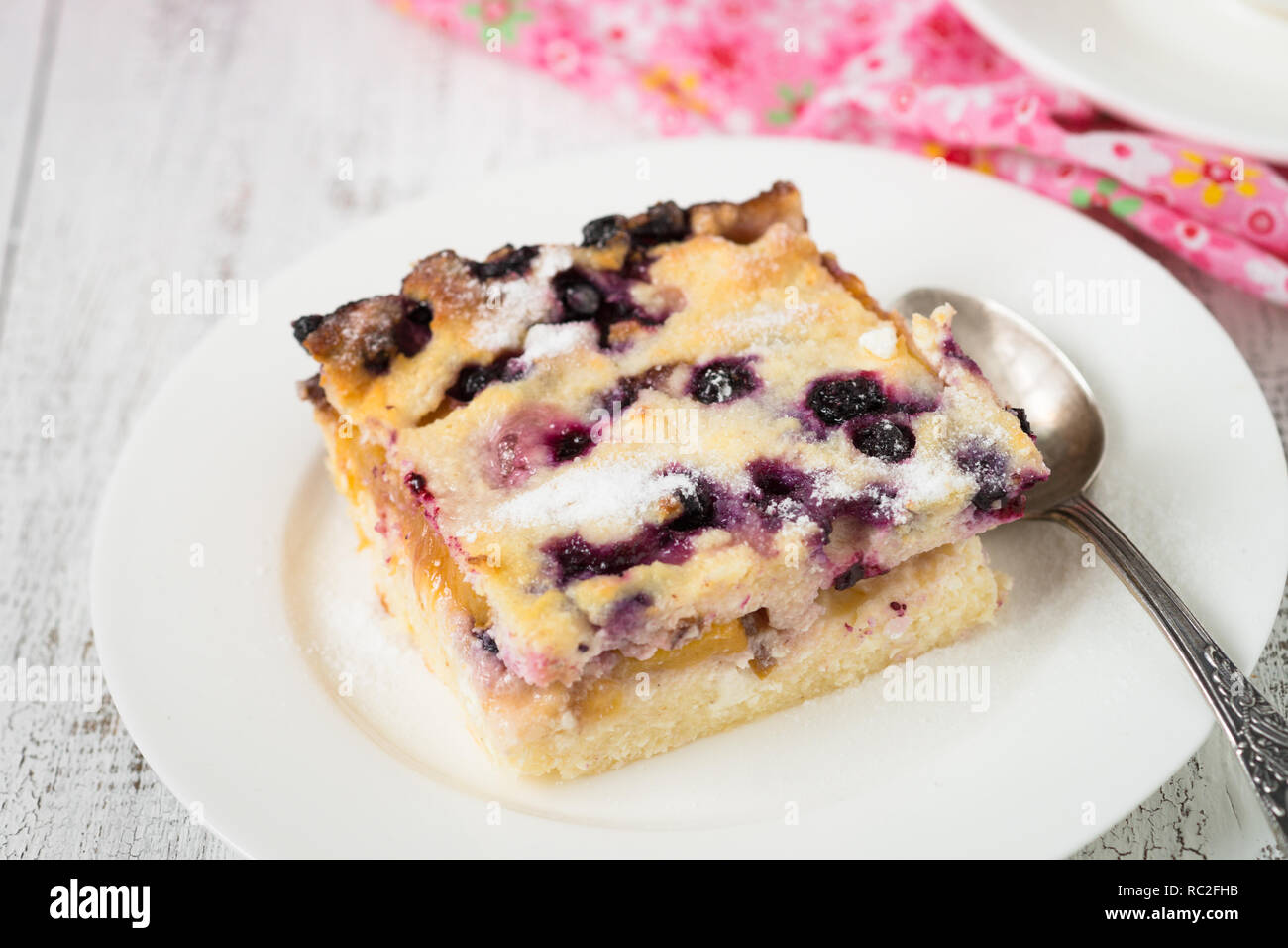 Cottage cheese casserole with peach and blueberry Stock Photo Alamy