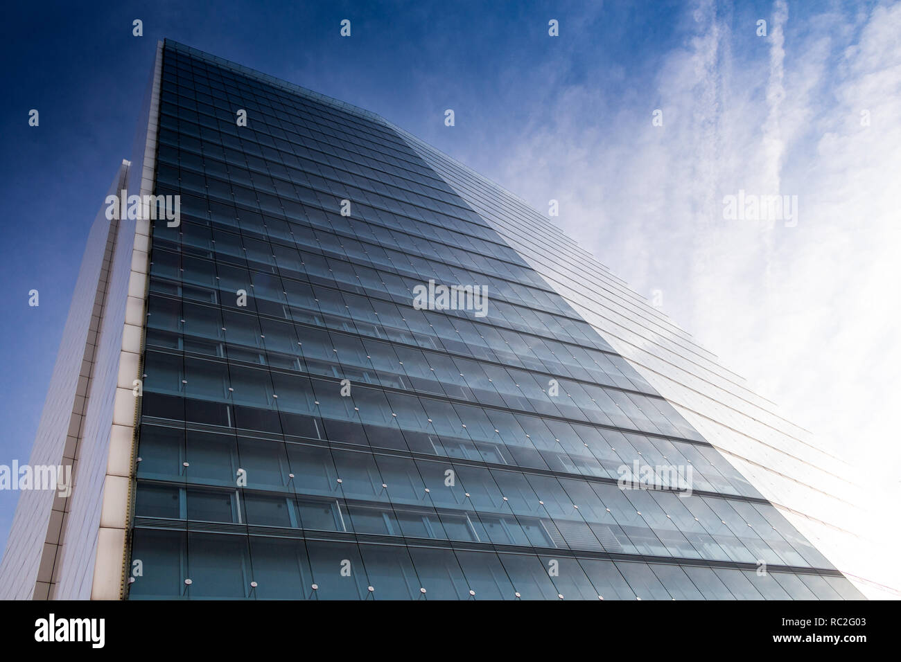 Modern office building with facade of reflective glass Stock Photo - Alamy