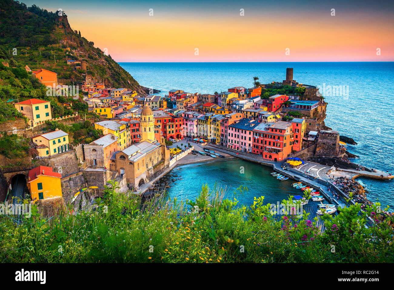 Majestic touristic village on the hill with colorful mediterranean buildings. Fantastic travel and photography place at sunset, Vernazza, Cinque Terre Stock Photo