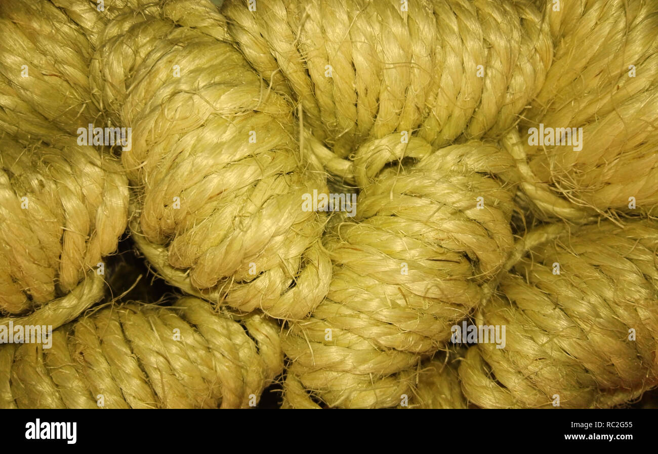 Natural rope clews stack up, close up view. Natural material background Stock Photo