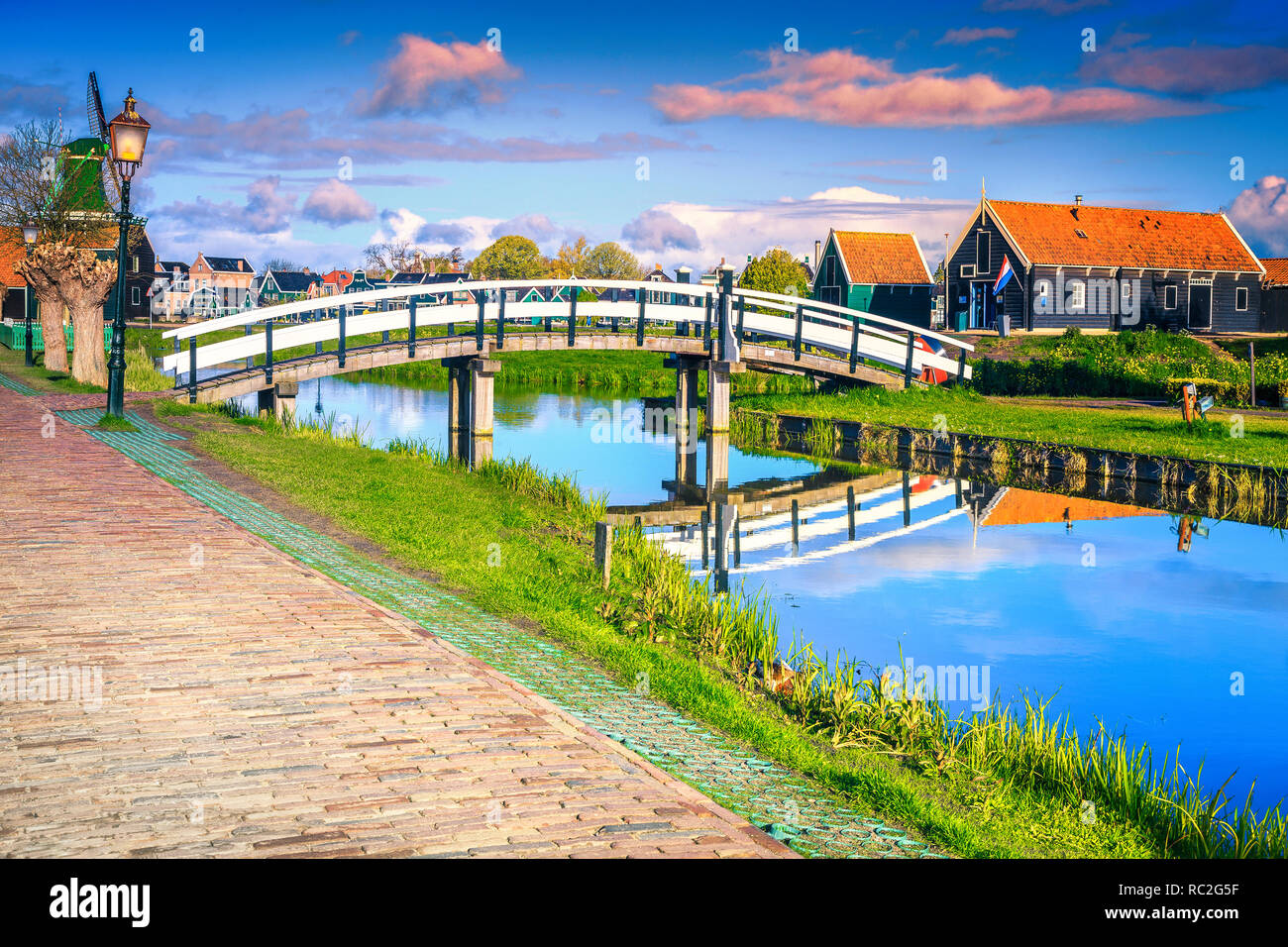 Amazing dutch travel destination. Fantastic touristic village museum and recreation place with admirable windmills, water canals, Zaanse Schans, Nethe Stock Photo