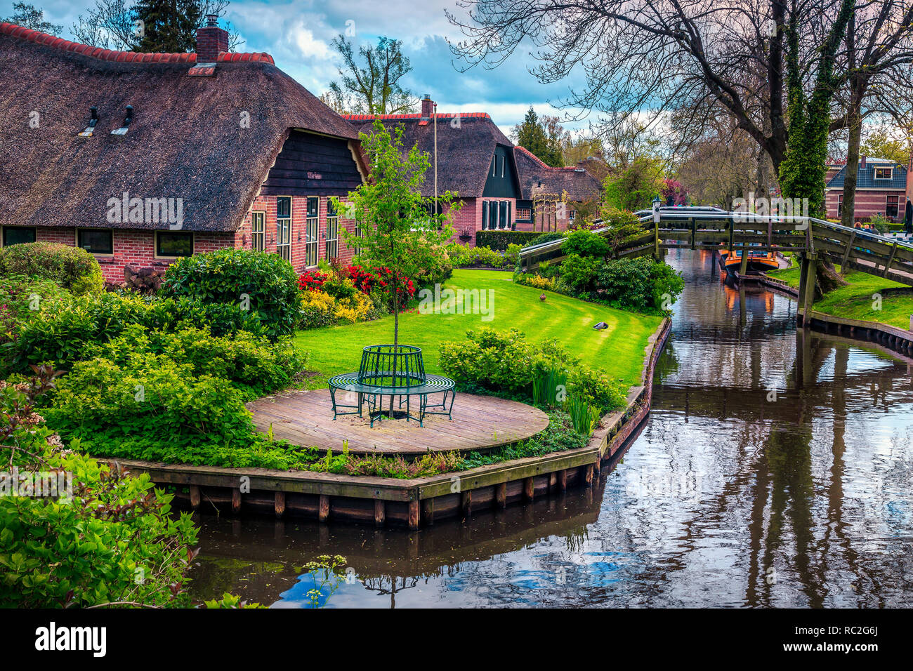Famous romantical travel destination. The best visited touristic European village with traditional dutch houses and ornamental gardens, Giethoorn, Net Stock Photo