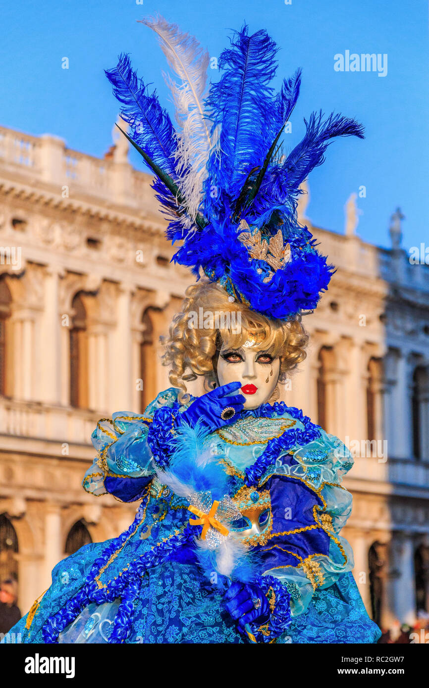 Venice, Italy. Woman with Costume Mask in the Saint Mark Square during Carnival Festival. Stock Photo