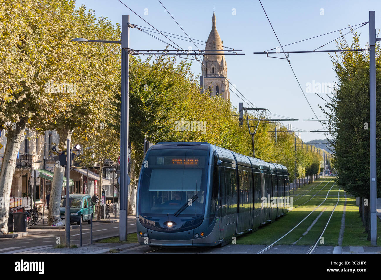 Bordeaux, France - 27th September, 2018: Tram passing through tree lined streets in the city of Bordeaux. Stock Photo