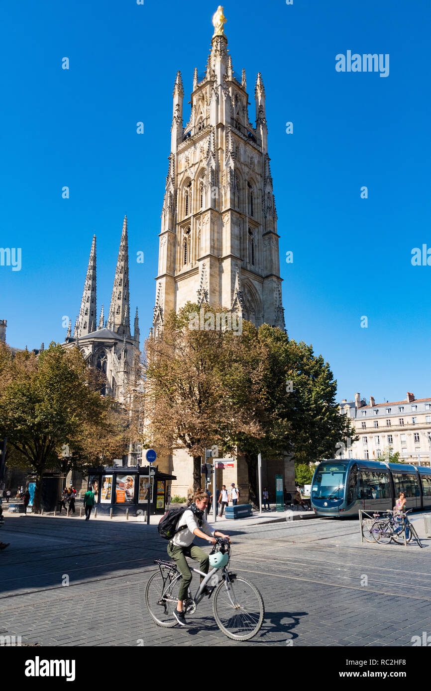 Bordeaux, France - 27th September, 2018: Cycalist passing by Cathedral Saint Andre in Bordeaux, France Stock Photo