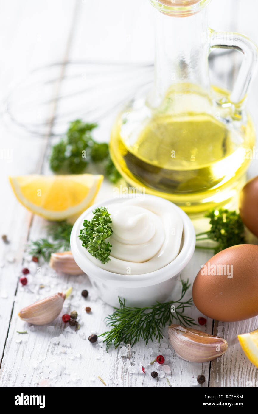 Mayonnaise sauce and ingredients on white Stock Photo Alamy