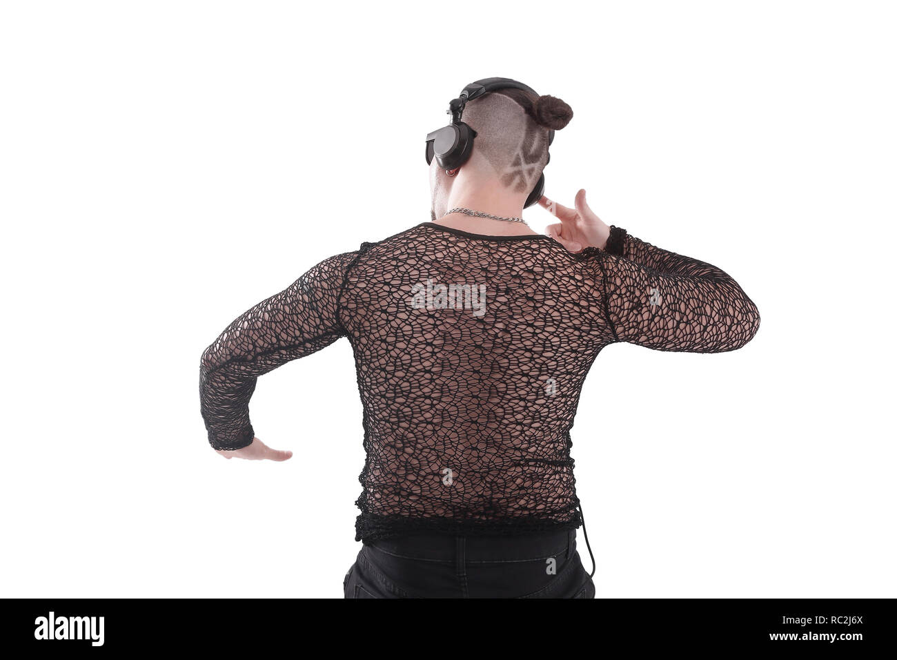Young Rapper Back View rear view .the guy rapper with a cool hair listens to music.isolated on ...
