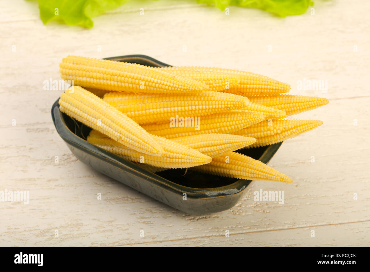 Young raw baby corn Stock Photo - Alamy