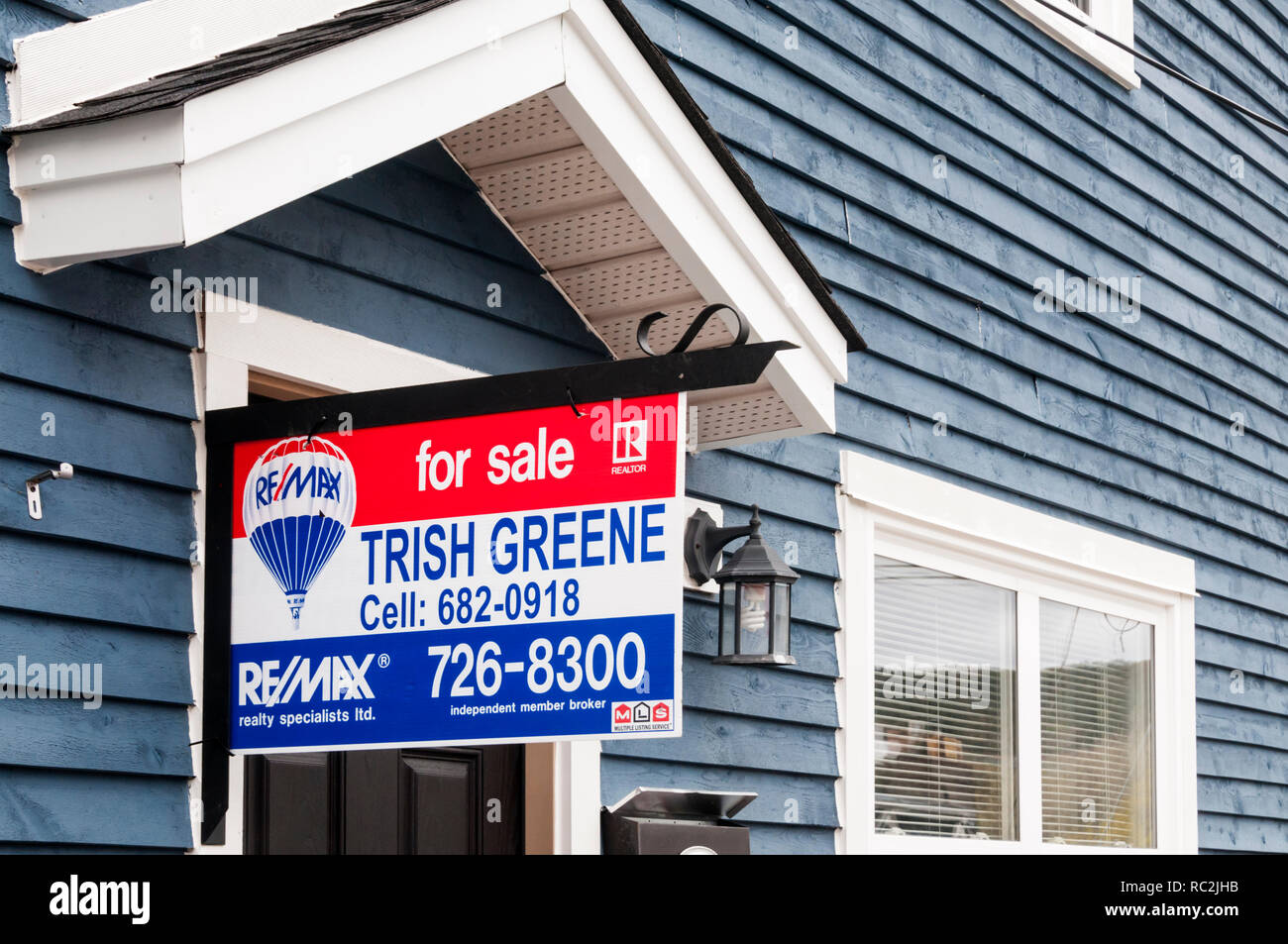 A For Sale sign on a house in St John's, Newfoundland, Canada. Stock Photo