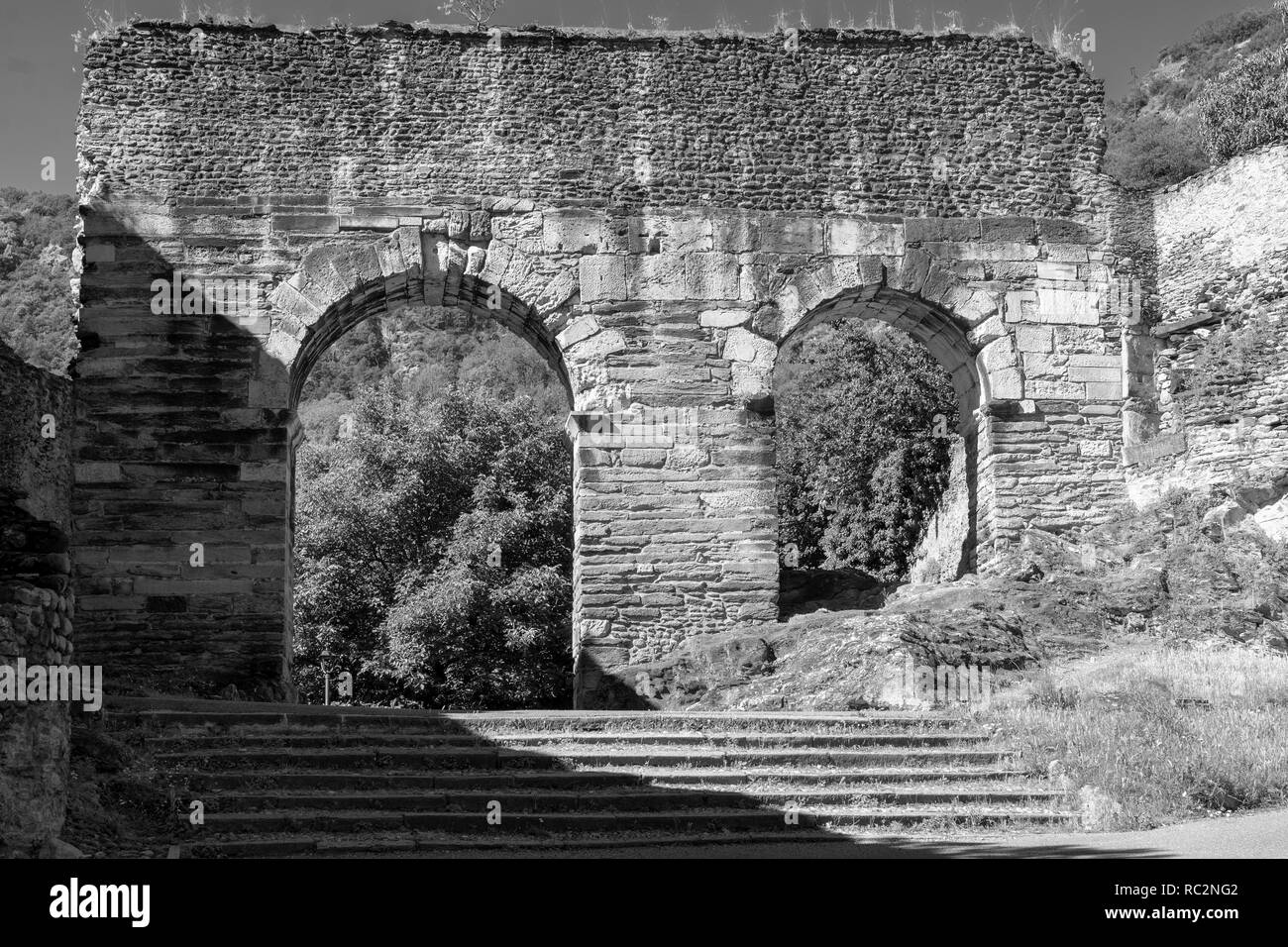 Susa, Turin, Piedmont, Italy: the Roman aqueduct. Black and white Stock Photo
