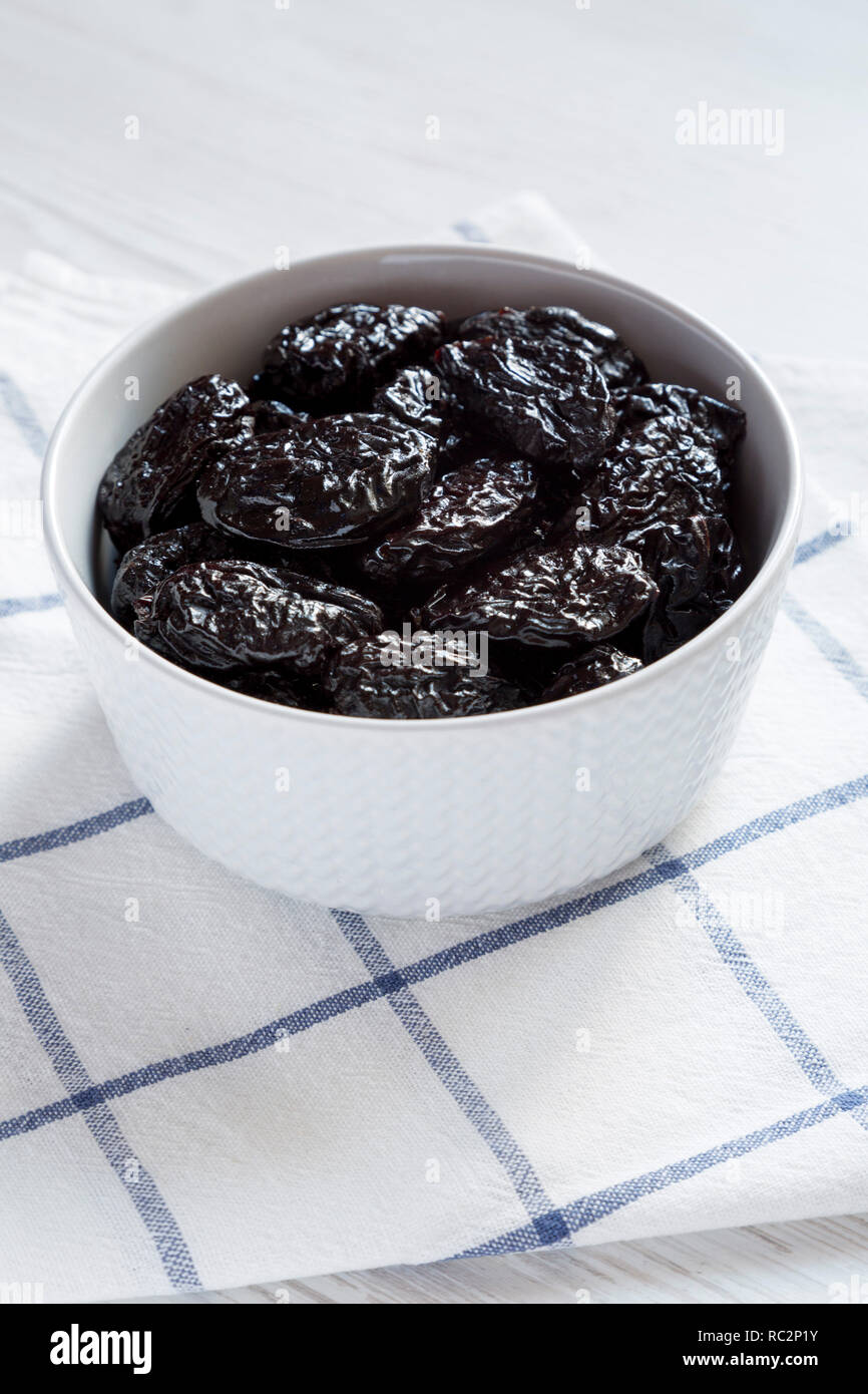 Full bowl of dry prunes, side view. Closeup Stock Photo Alamy