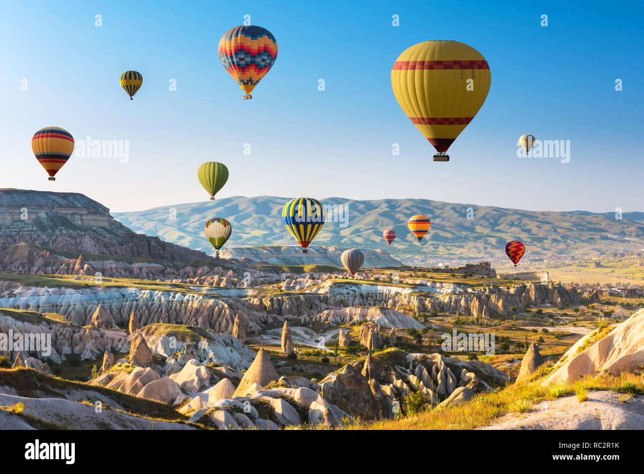 Hot air balloons flying in sunset sky Cappadocia, Turkey Stock Photo