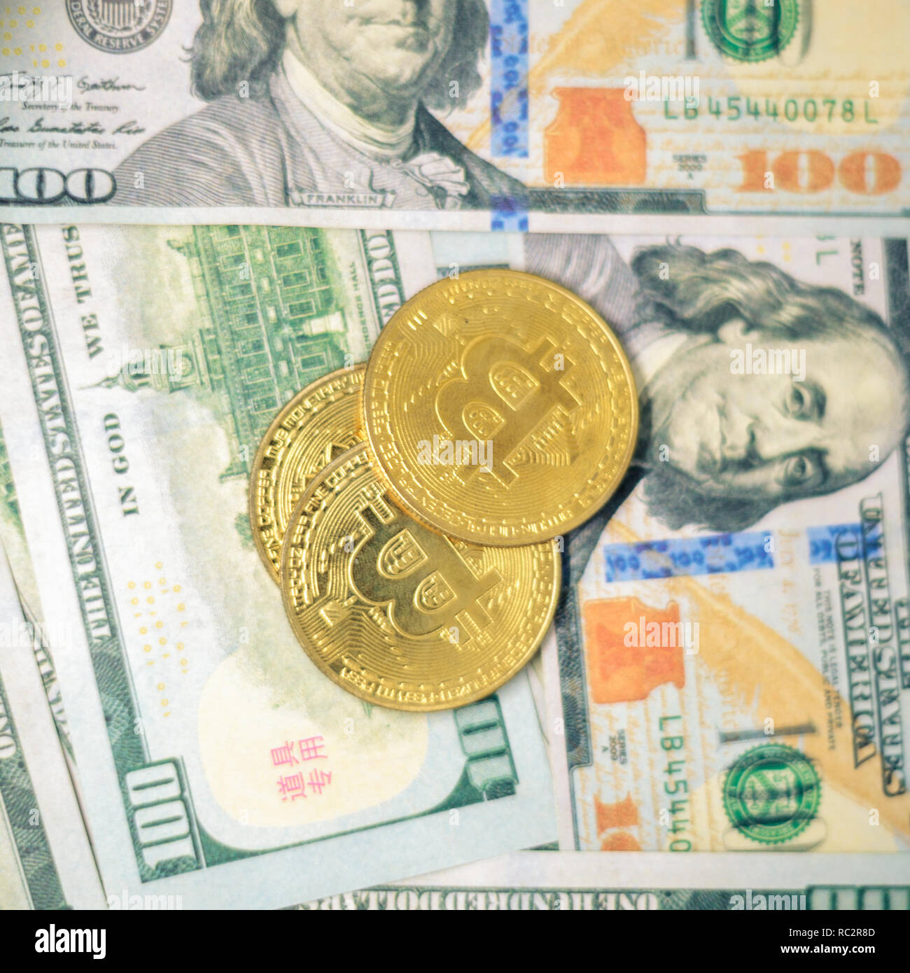 Cryptocurrency with US 100 dollar bills Stock Photo