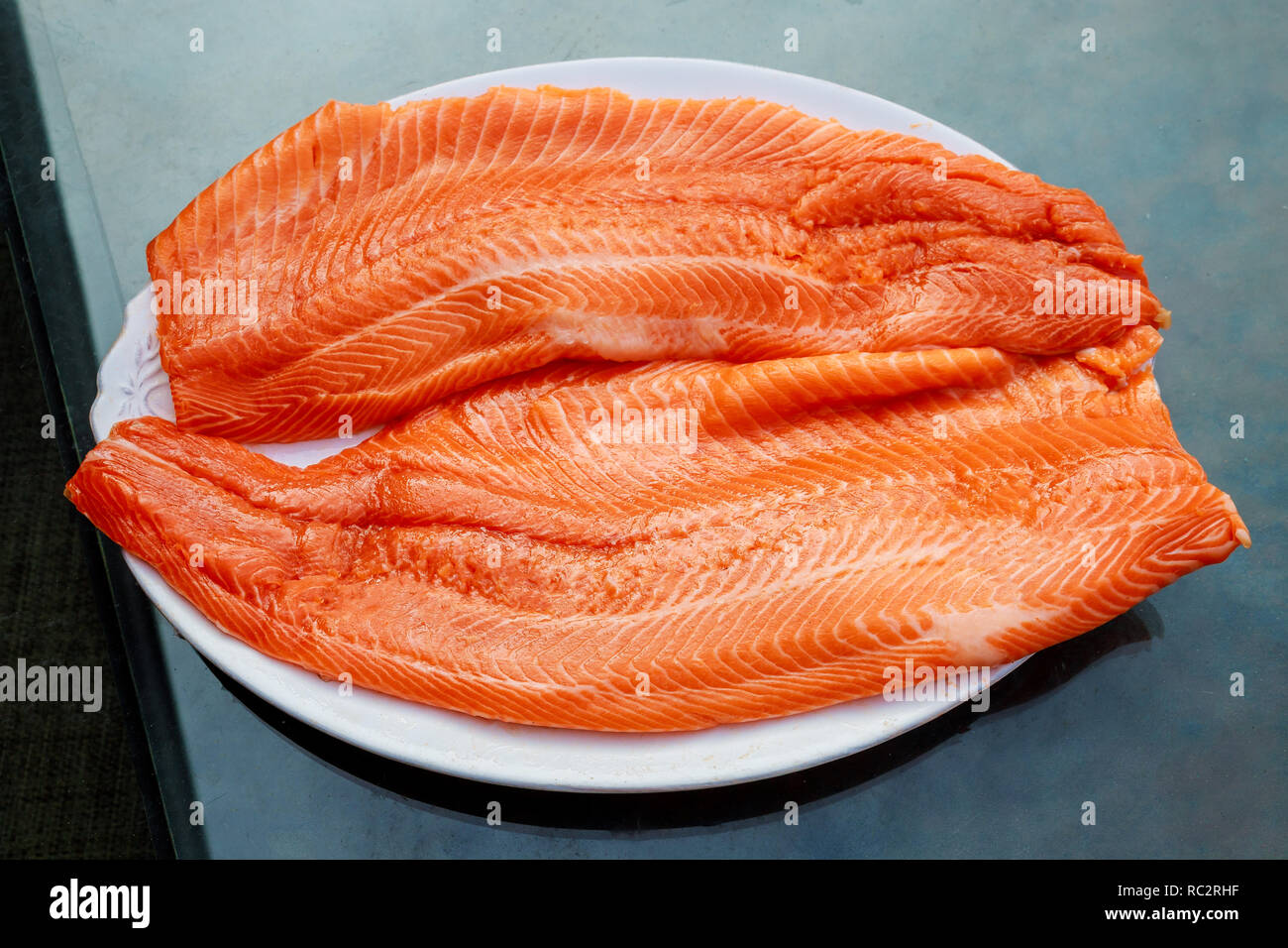 Raw salmon filet on dark slate background, atlantic fish Stock Photo ...