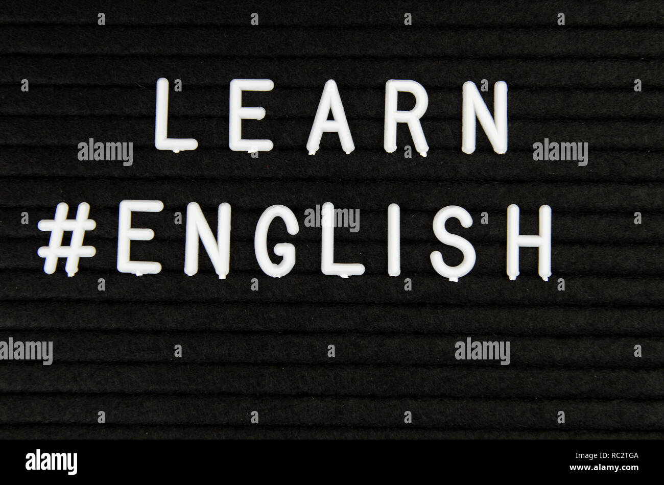 Learn languages sign on black background Stock Photo - Alamy