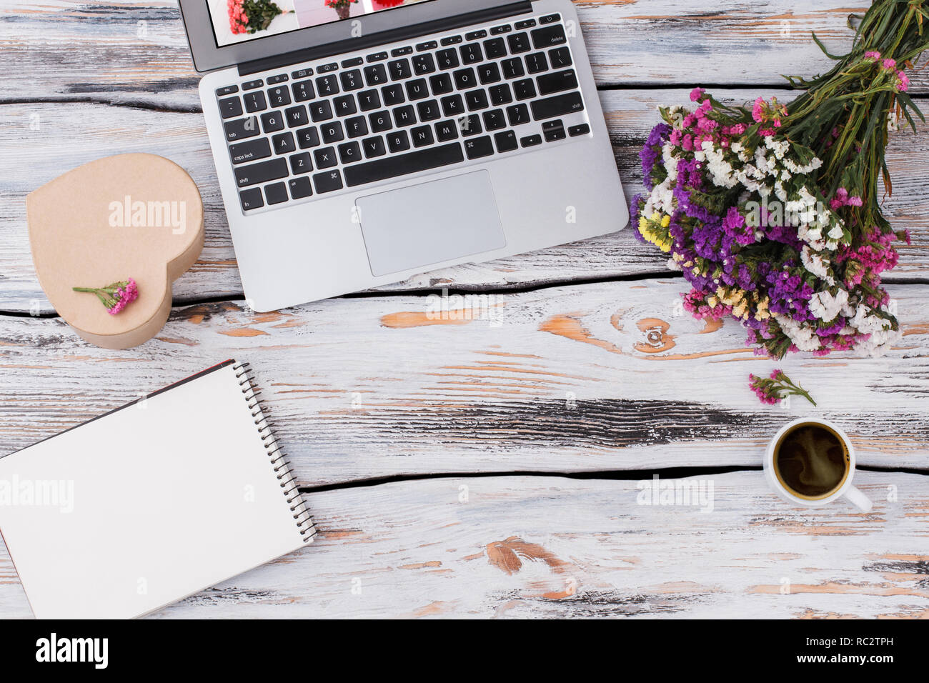 Office Desk With Laptop Flowers Bouquet Coffee Mug Notepad On