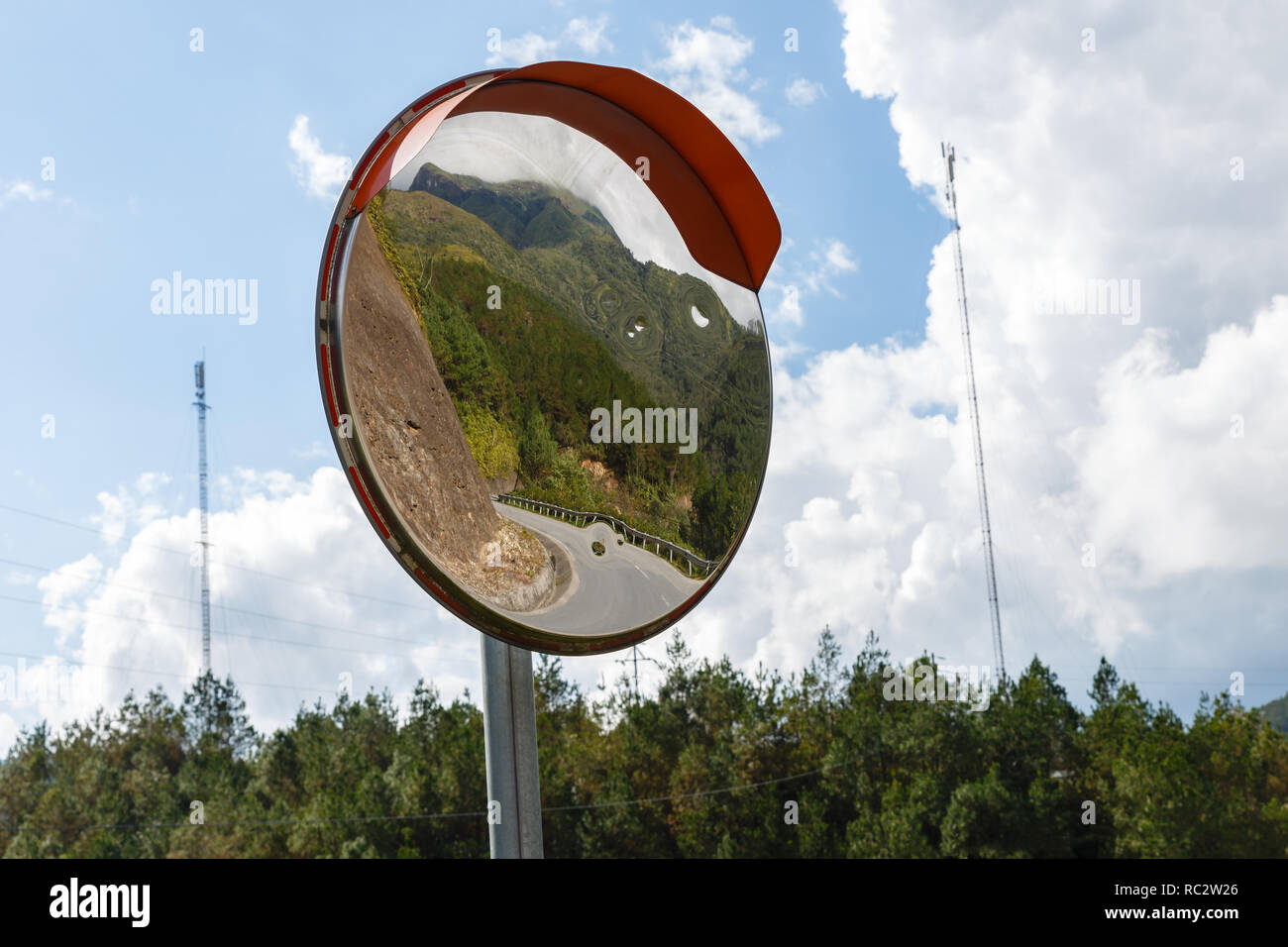 The traffic curve mirror, mountain road Vietnam Stock Photo