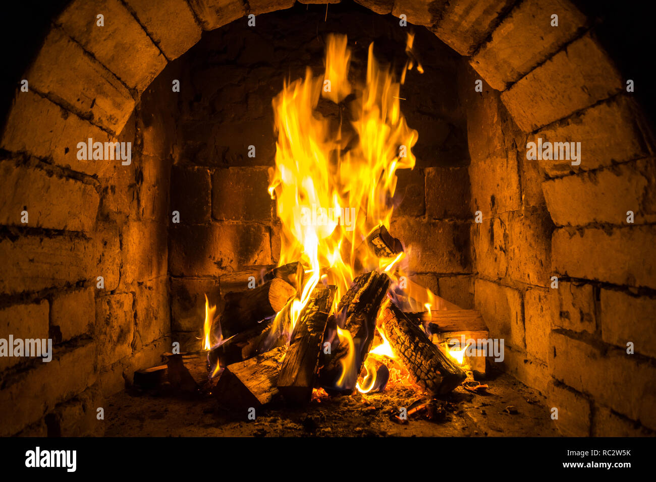 Wood Burning In A Cozy Fireplace At Home Keep Warm Stock Photo